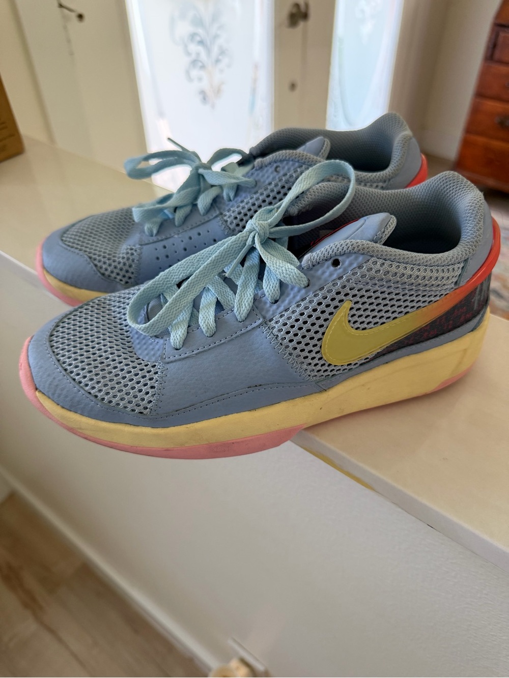 Nike Kids Light Blue Sneakers with Yellow Swoosh and Pink Accents